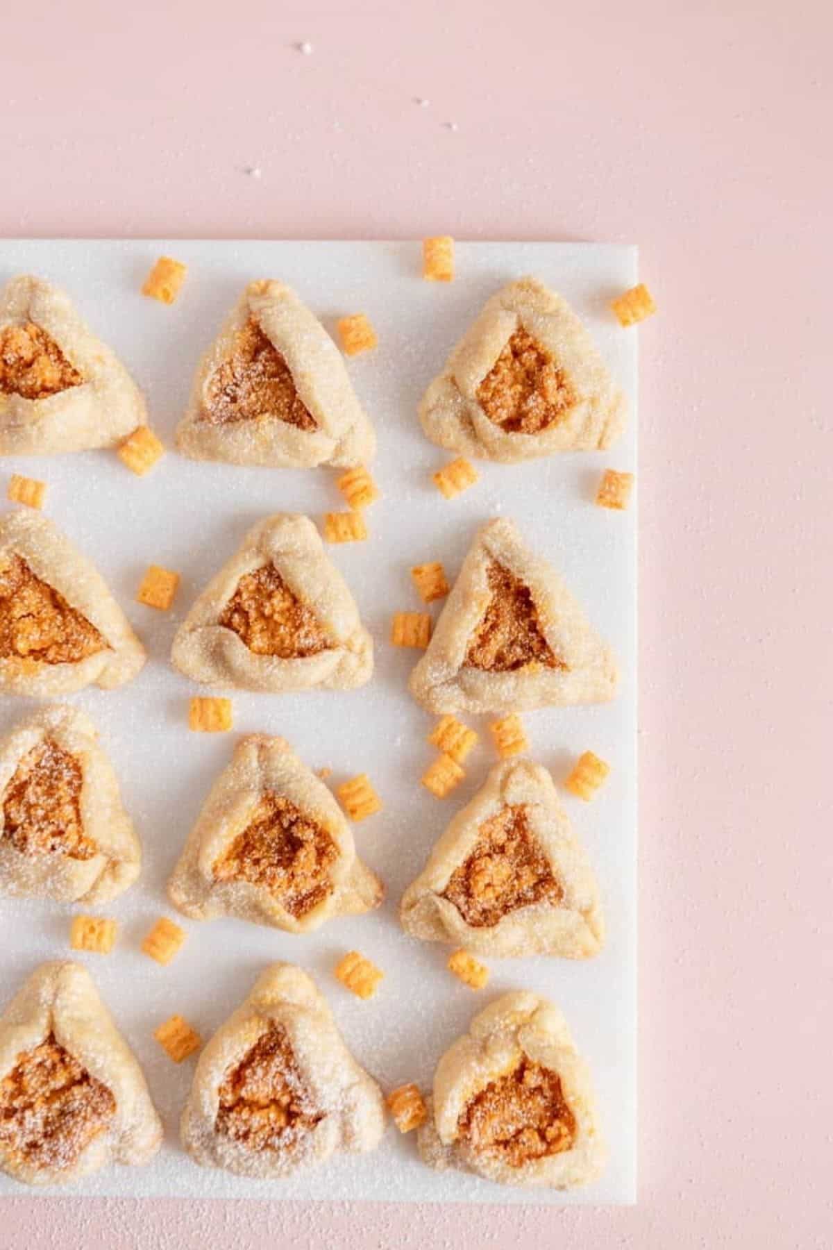 overhead photo of captain crunch hamantaschen and cereal