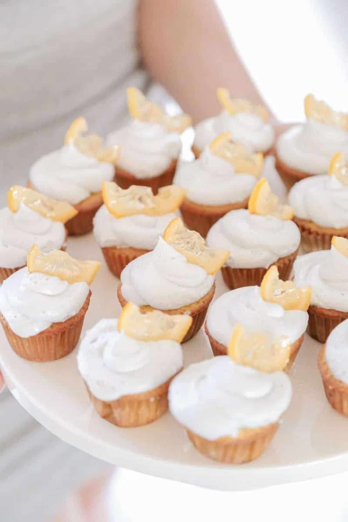 mini lemon lavender cupcakes being held on a dish
