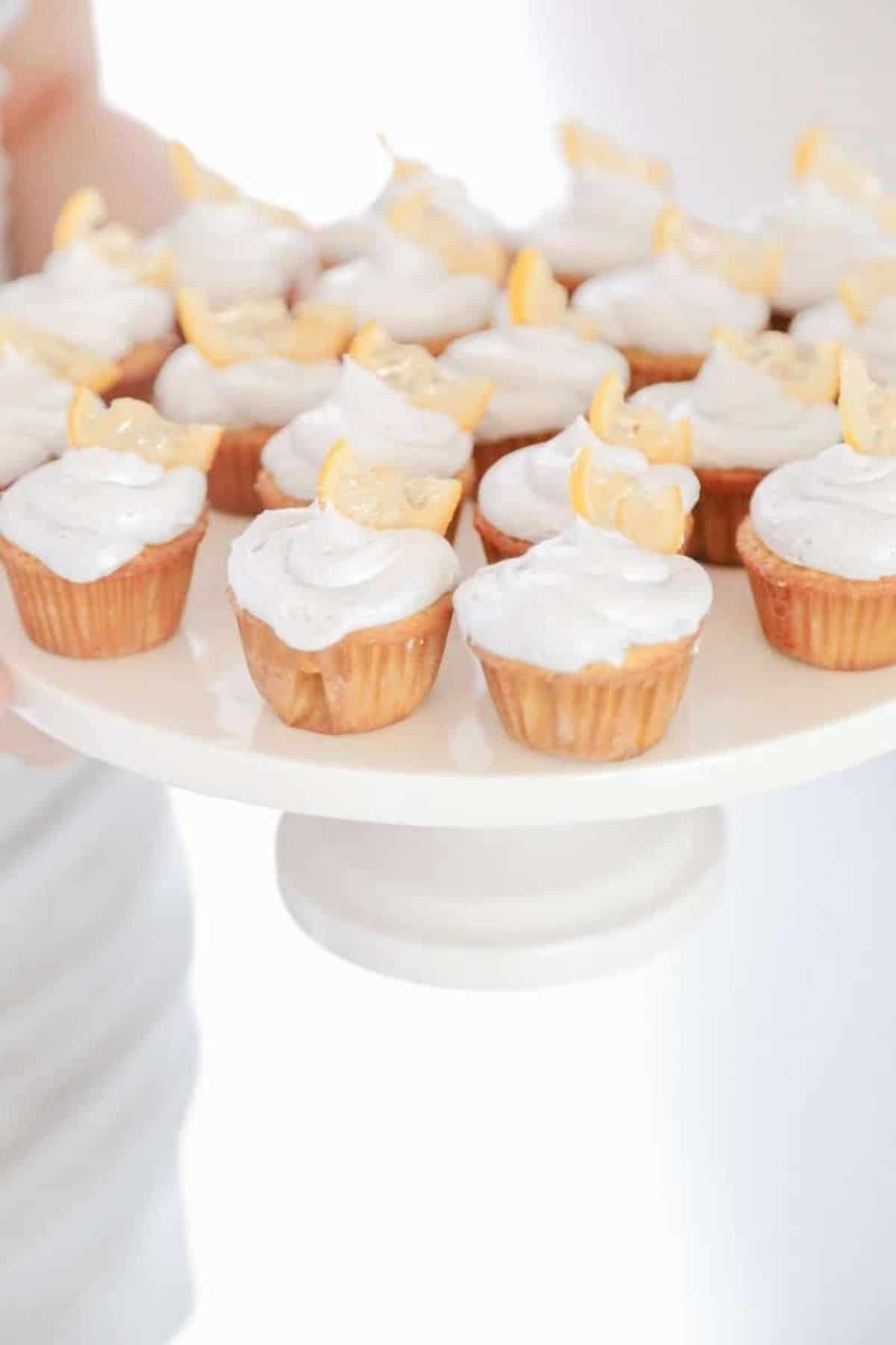 mini lemon lavender cupcakes on a cake dish