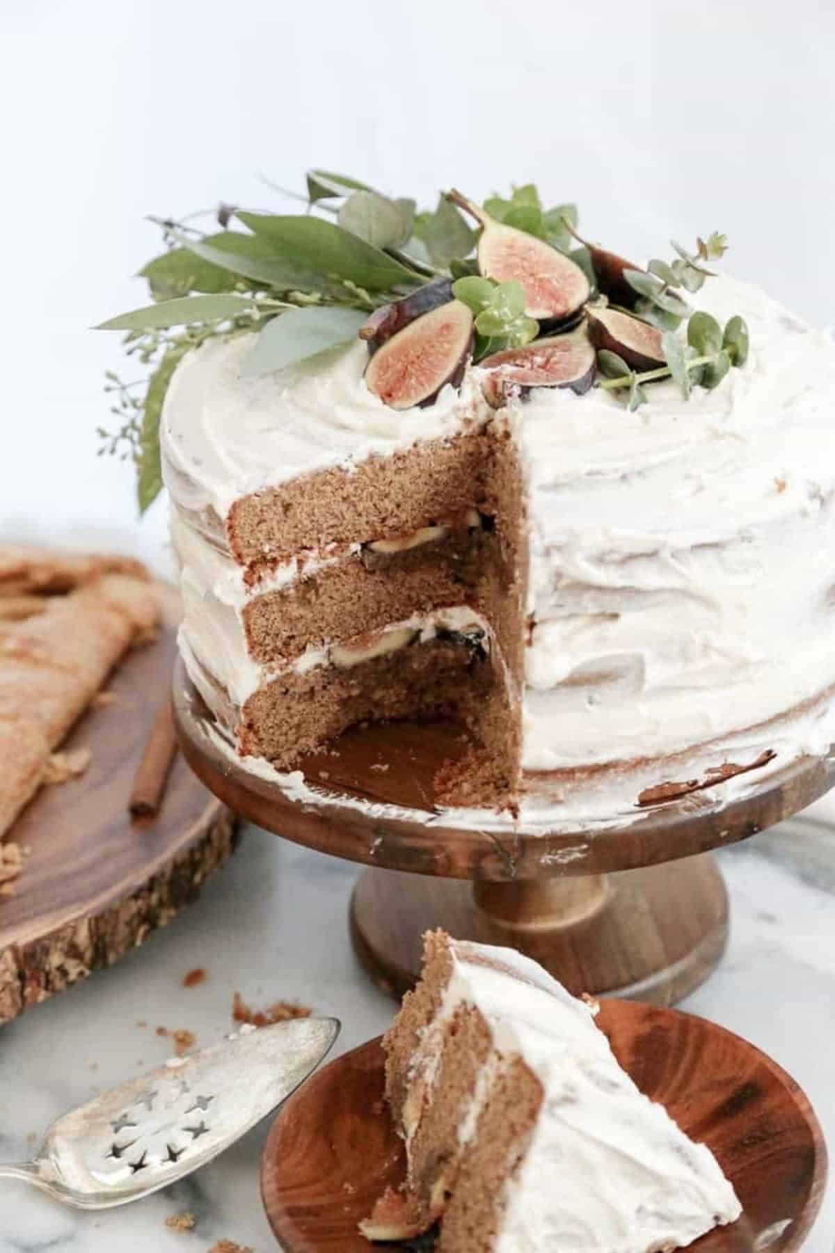 chai spiced fig cake on a cake stand sliced cake