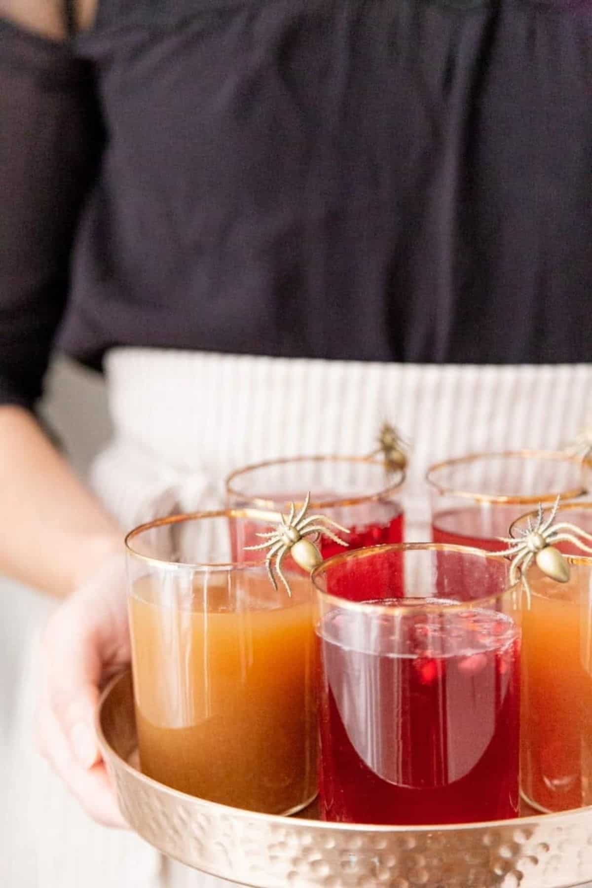 apple cider pomegranate sparklers with spiders close