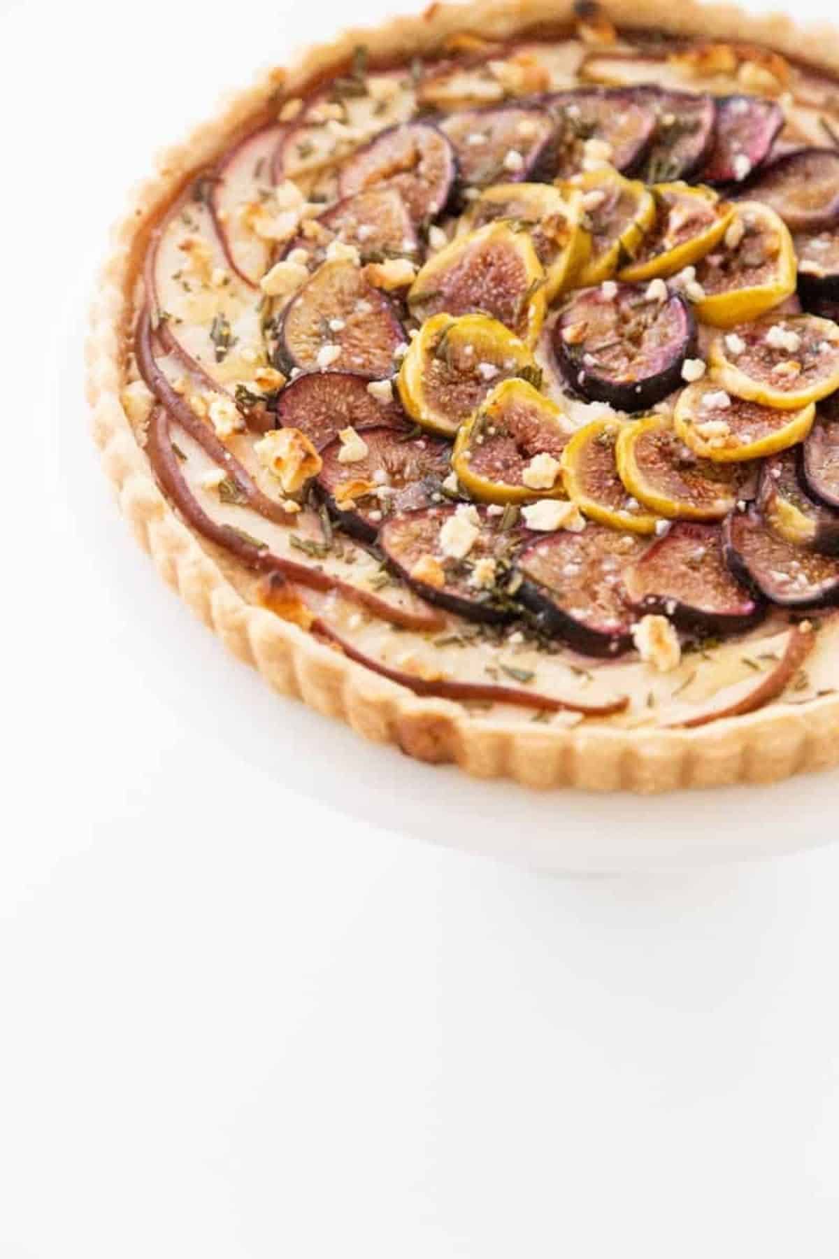 pear and fig tart on a platter