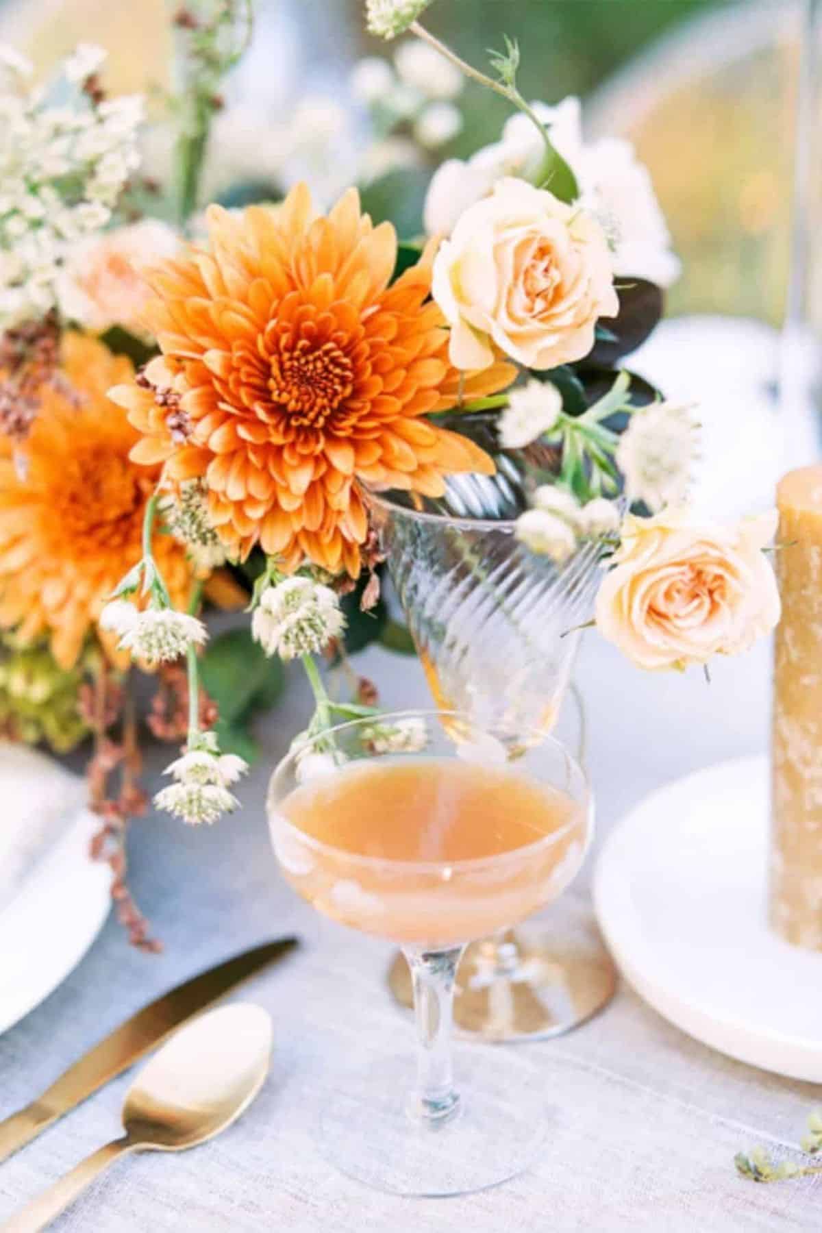 apple cider bourbon cocktail in a martini glass