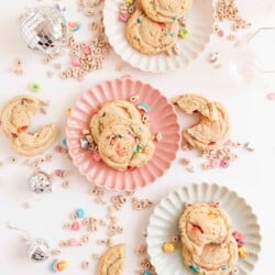 two cookies on a plate with a bite taken out of one