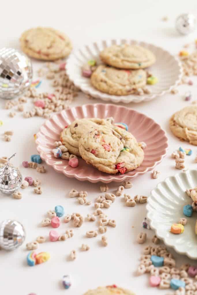cookies on a plate surrounded by cereal and disco balls