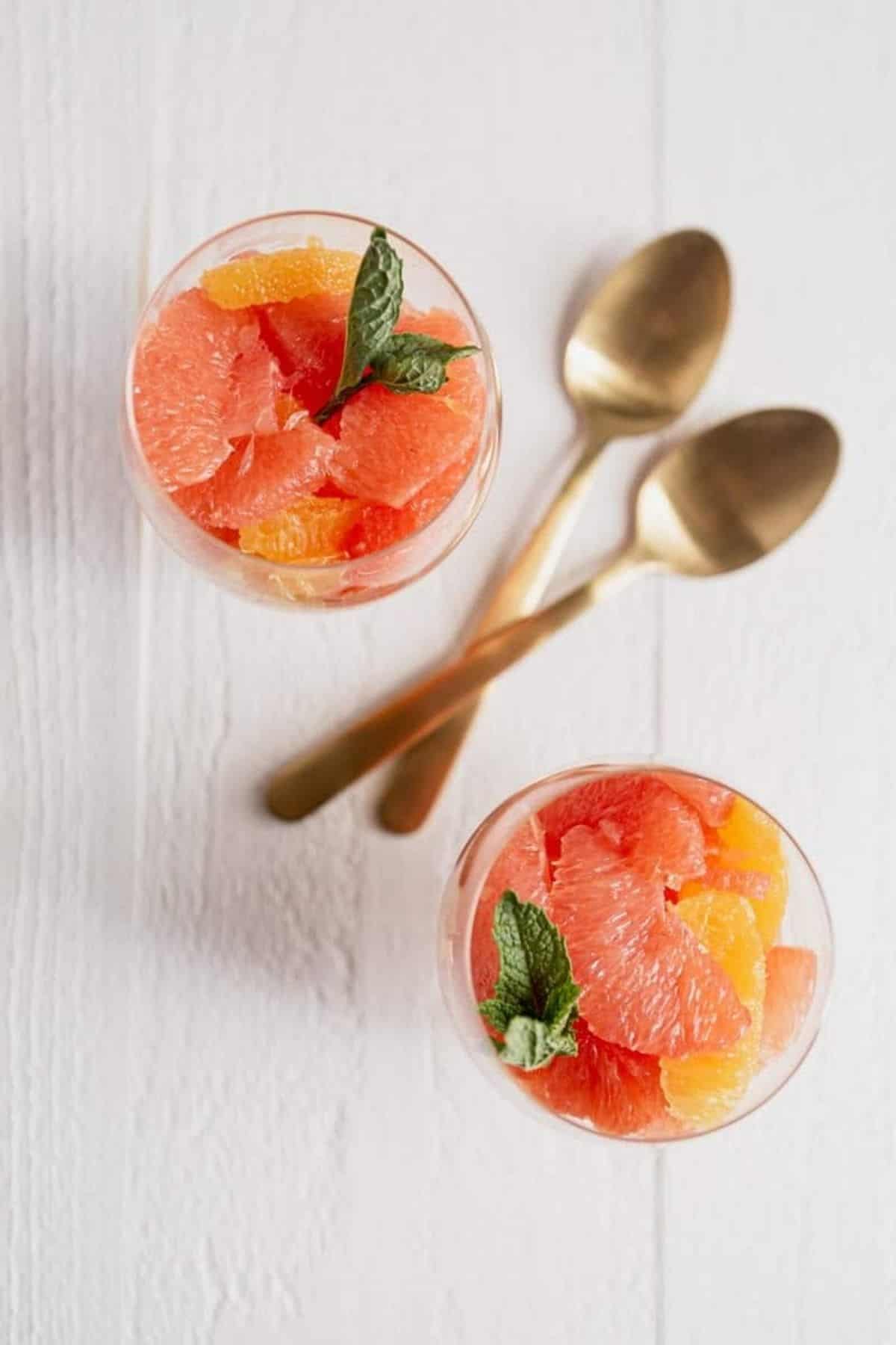 two citrus fruit cups