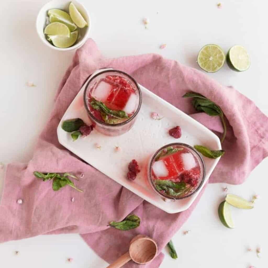 raspberry mojitos with mint and limes