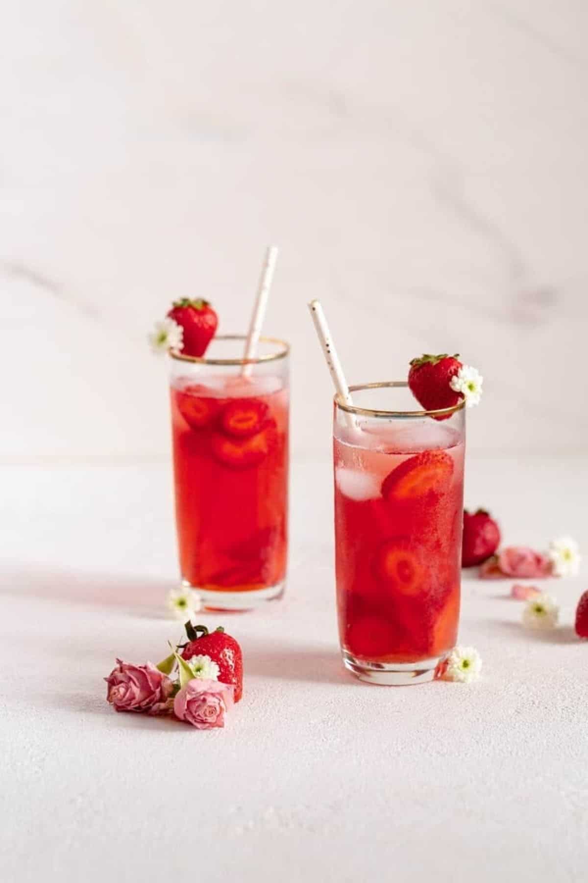 Straws in strawberry iced teas