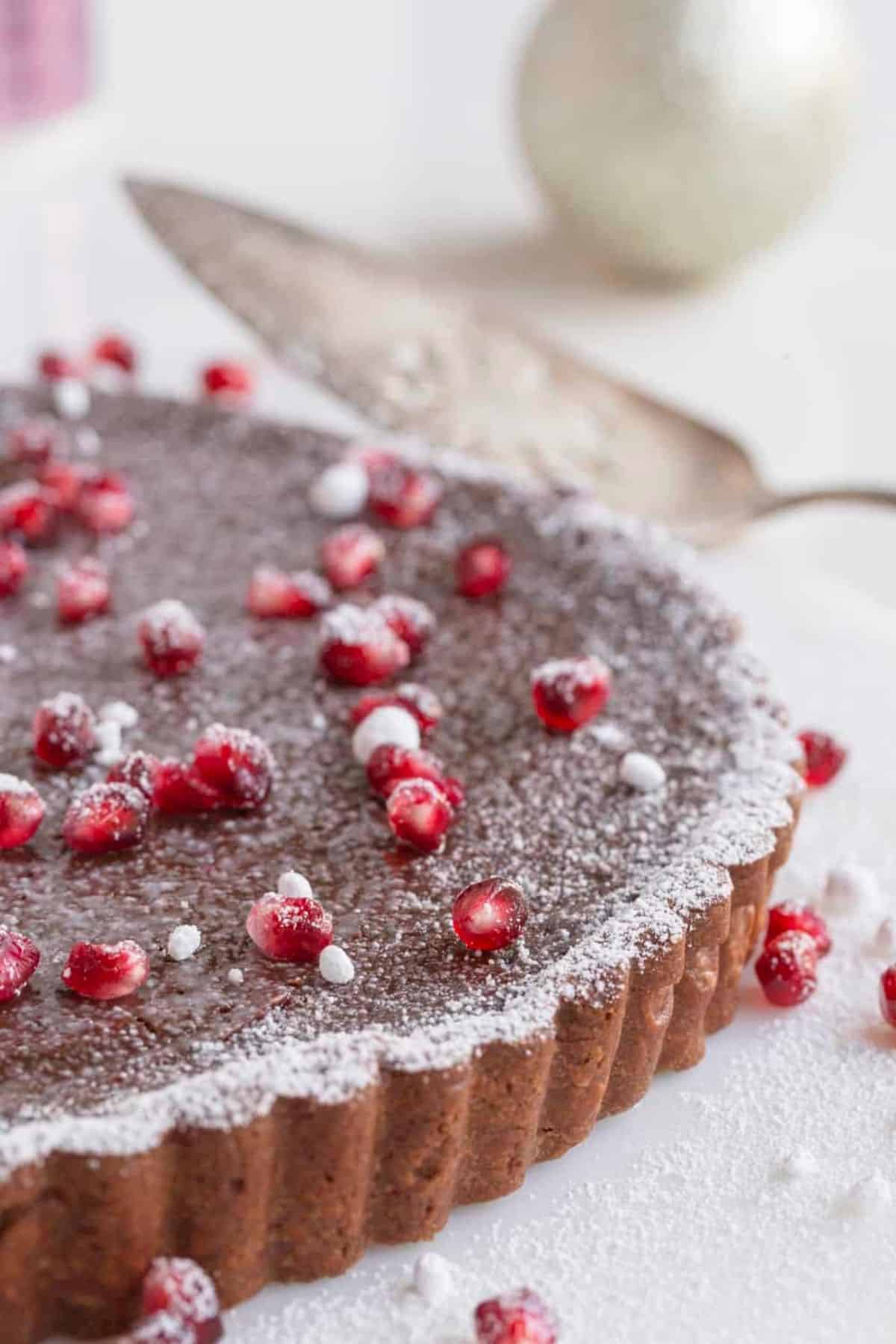 close up of chocolate tart and pomegranates