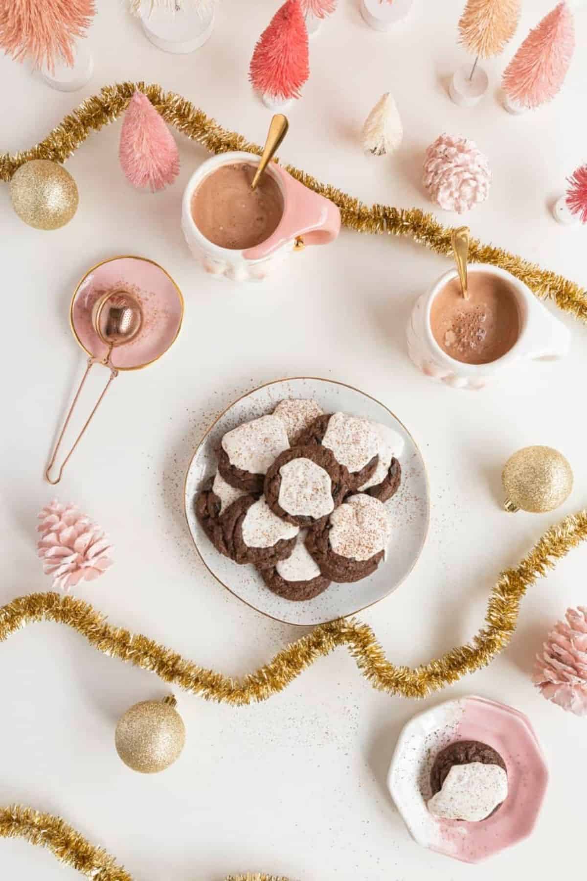 overhead of cookies and hot chocolate and holiday decor