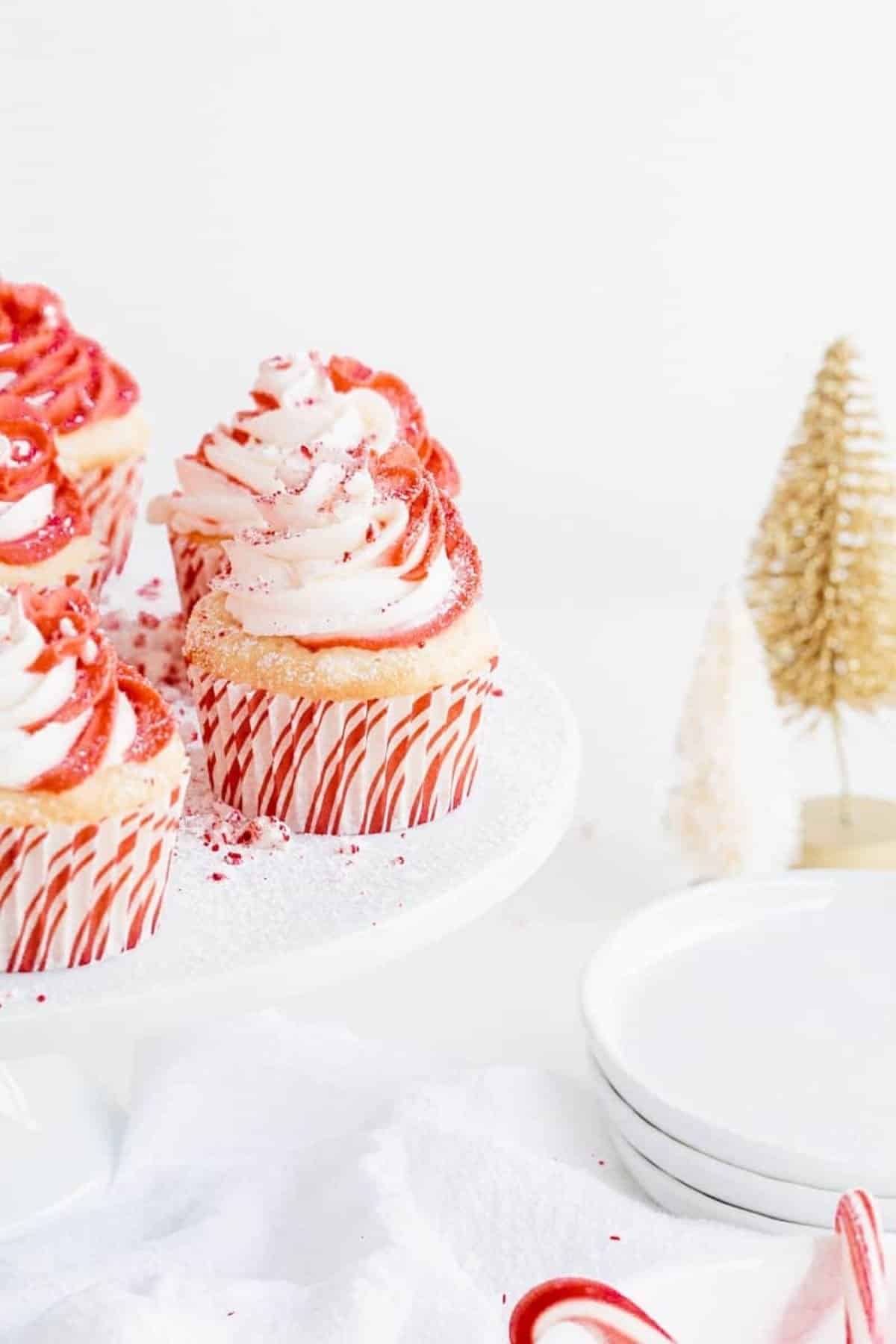 cupcakes on cake stand and Christmas tree