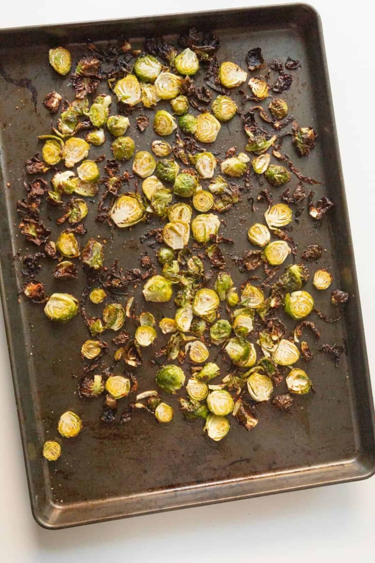 cooked brussel sprouts on sheet pan