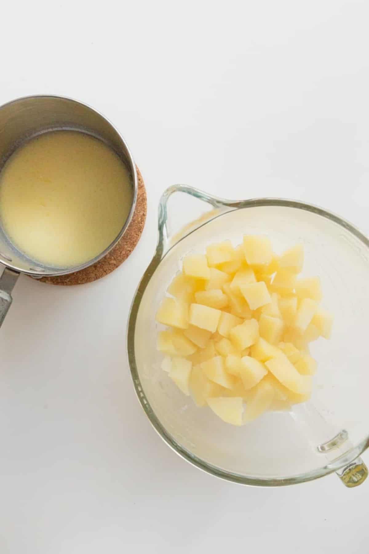 potatoes and sauce pan of butter and milk