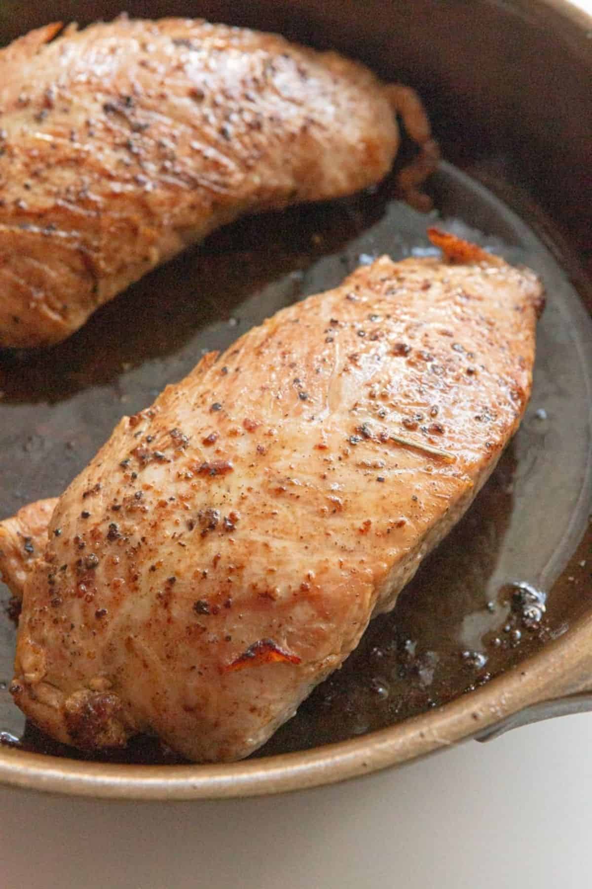 cooked turkey tenderloin in cast iron skillet