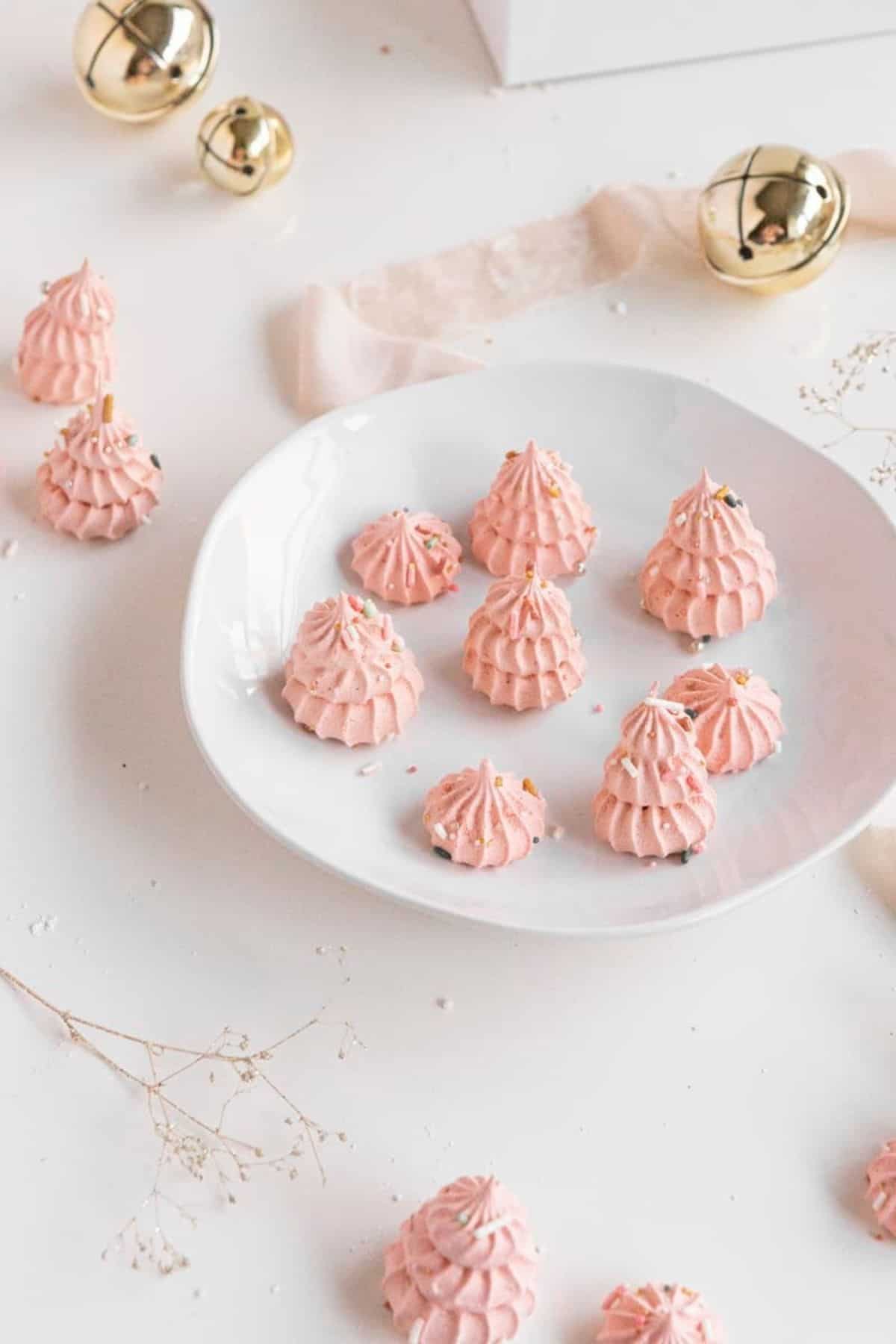 Christmas tree pink meringue candies on plate