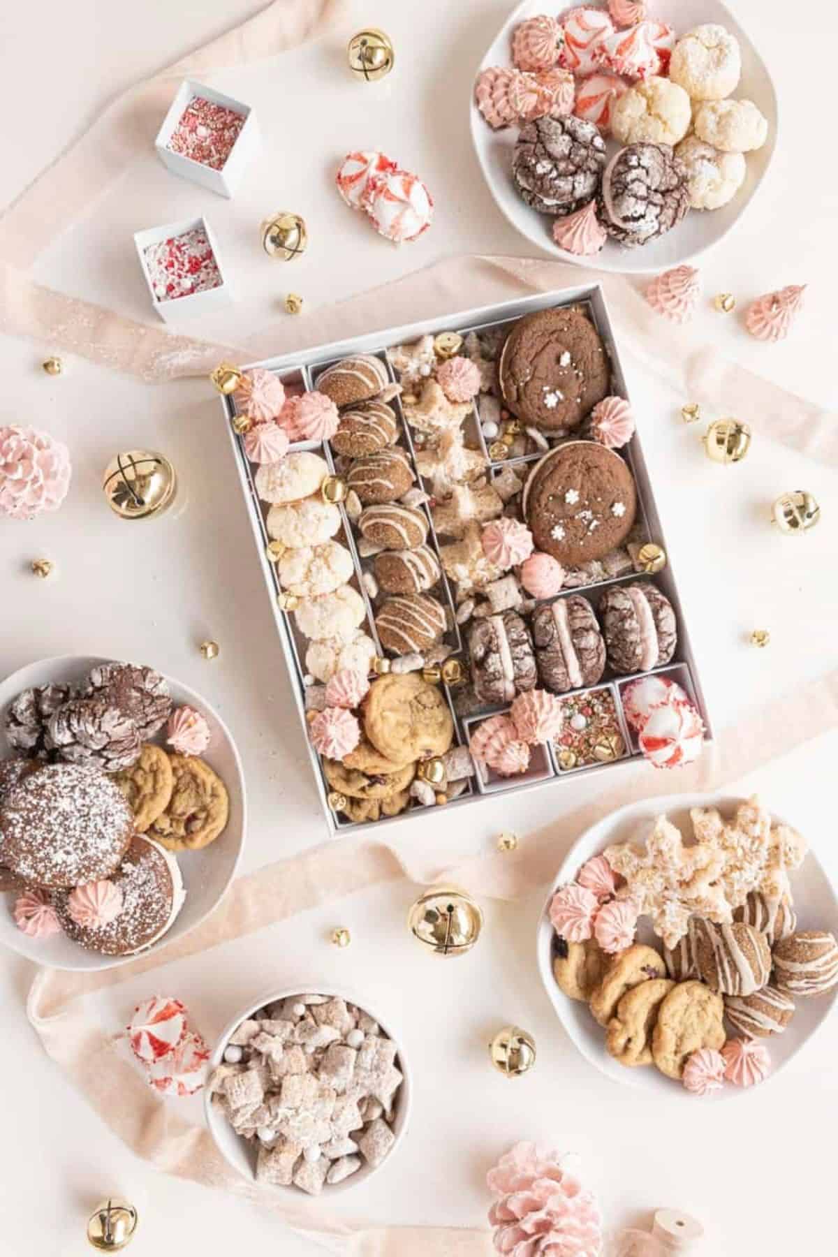 overhead of holiday cookie box with various treats