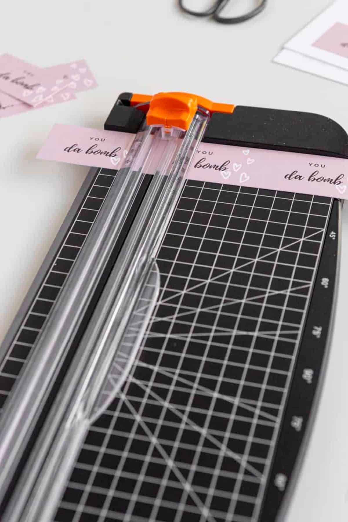 tags being cut in paper cutter