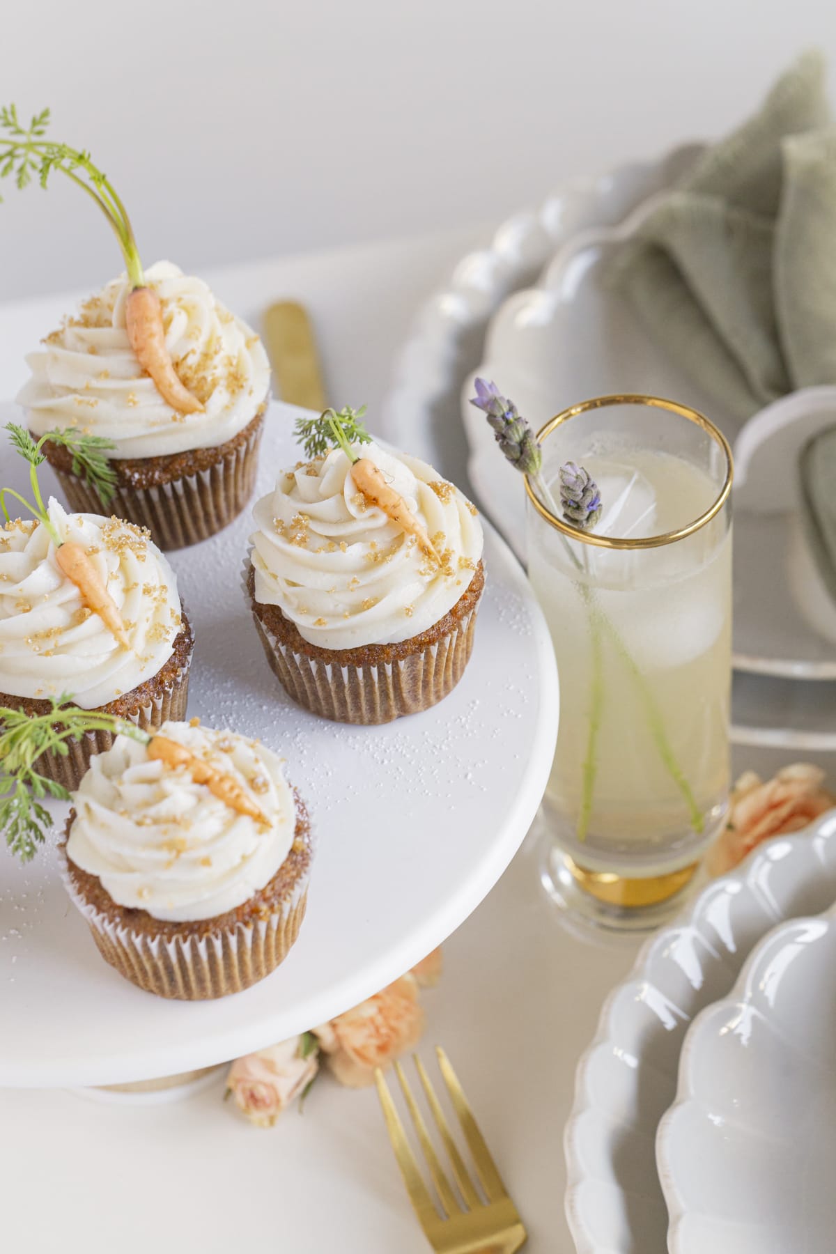 carrot cakes on a cake stand, lemonade with flowers