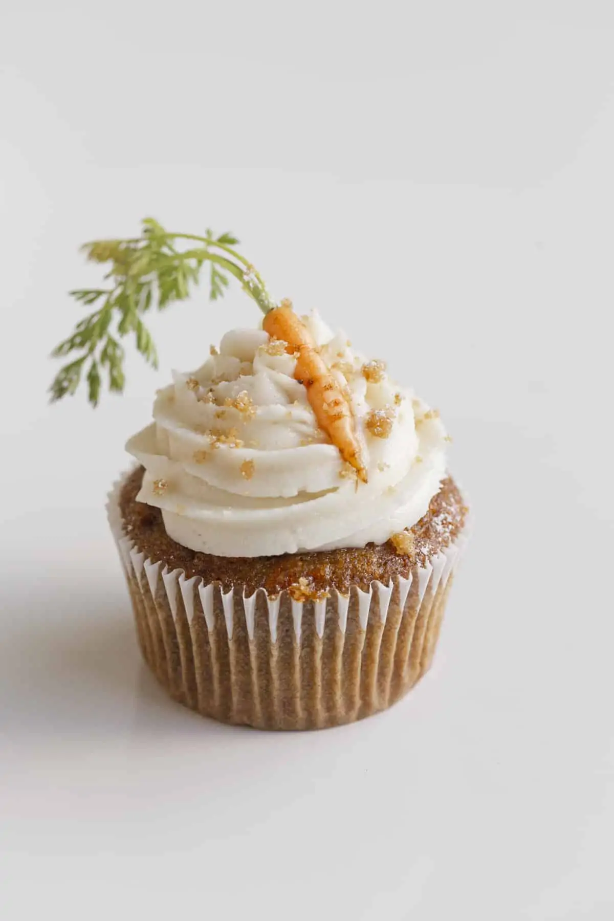 carrot cake for two - cupcake with frosting, crumble, and carrots