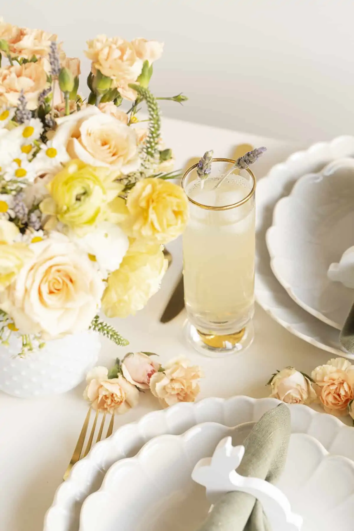 easter tablescape with yellow flowers and lavender cocktail