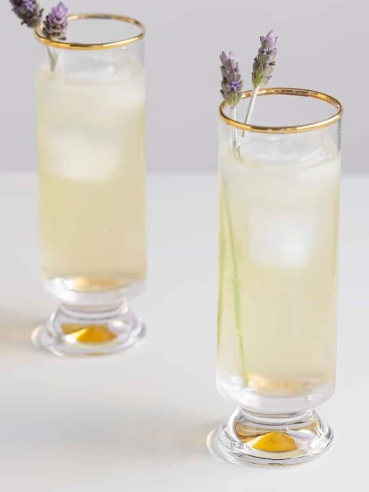 Lavender lemonade alcoholic drink with lender stems and ice