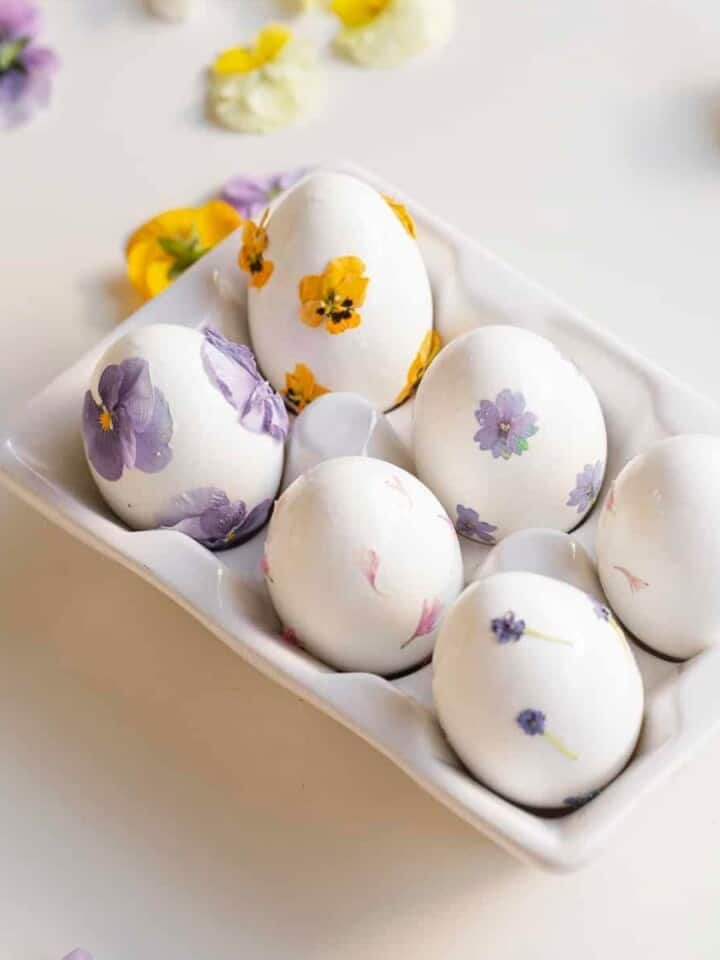 easter eggs in a tray with flowers