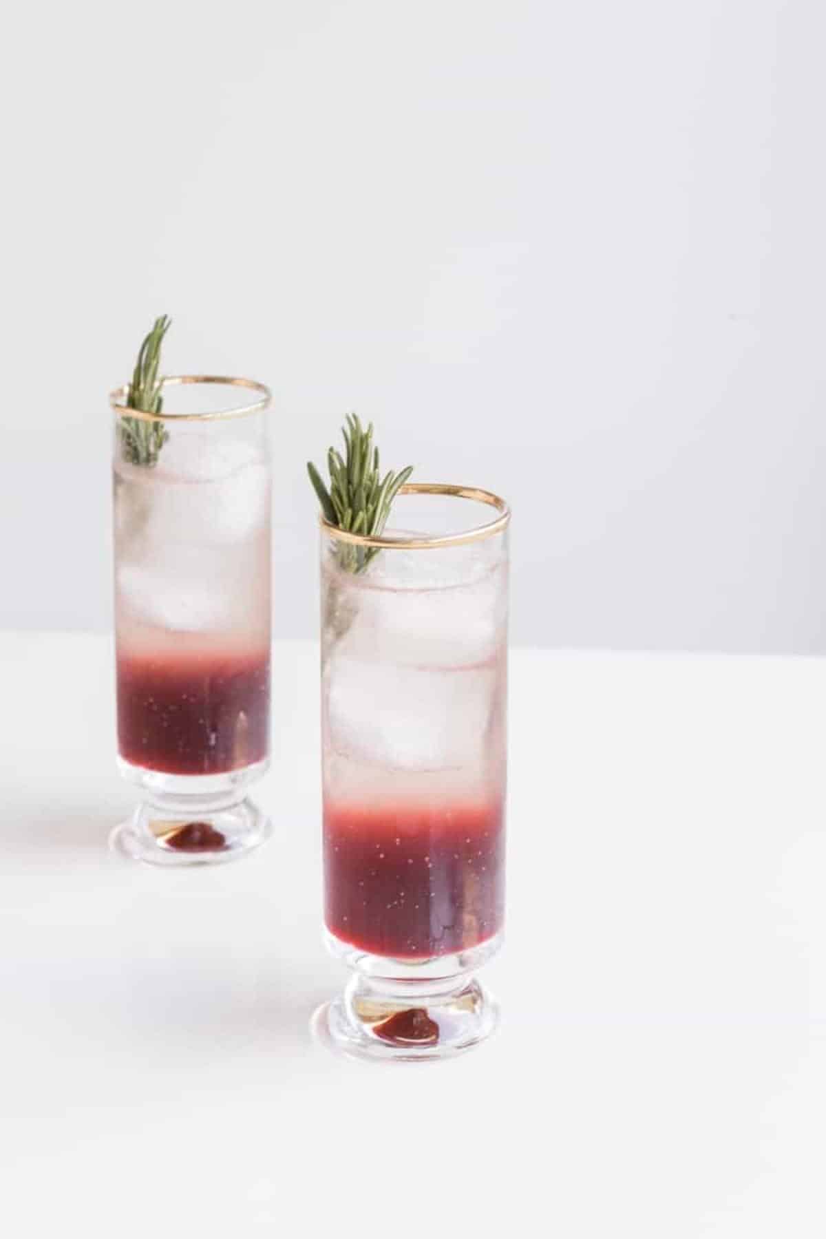 step 3: glasses with grape mix and ginger beer and rosemary