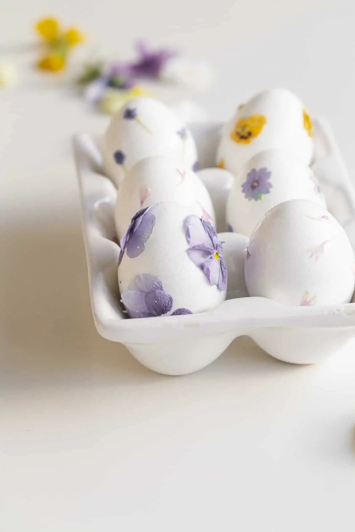 Pressed Flower Easter Eggs in a porcelain tray