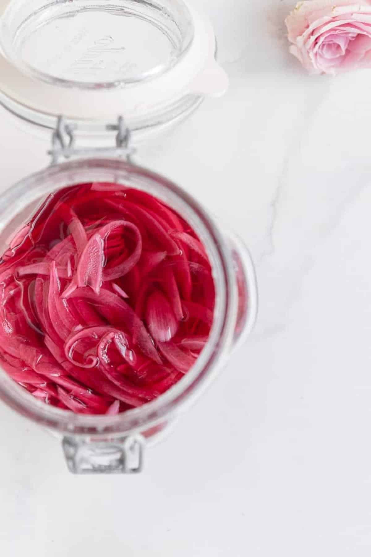 onions in a jar on marble