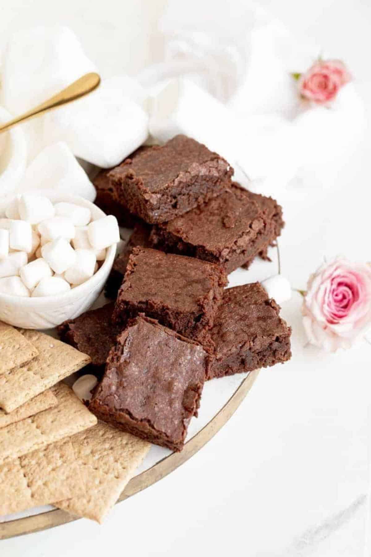 chewy brownies on a treats board