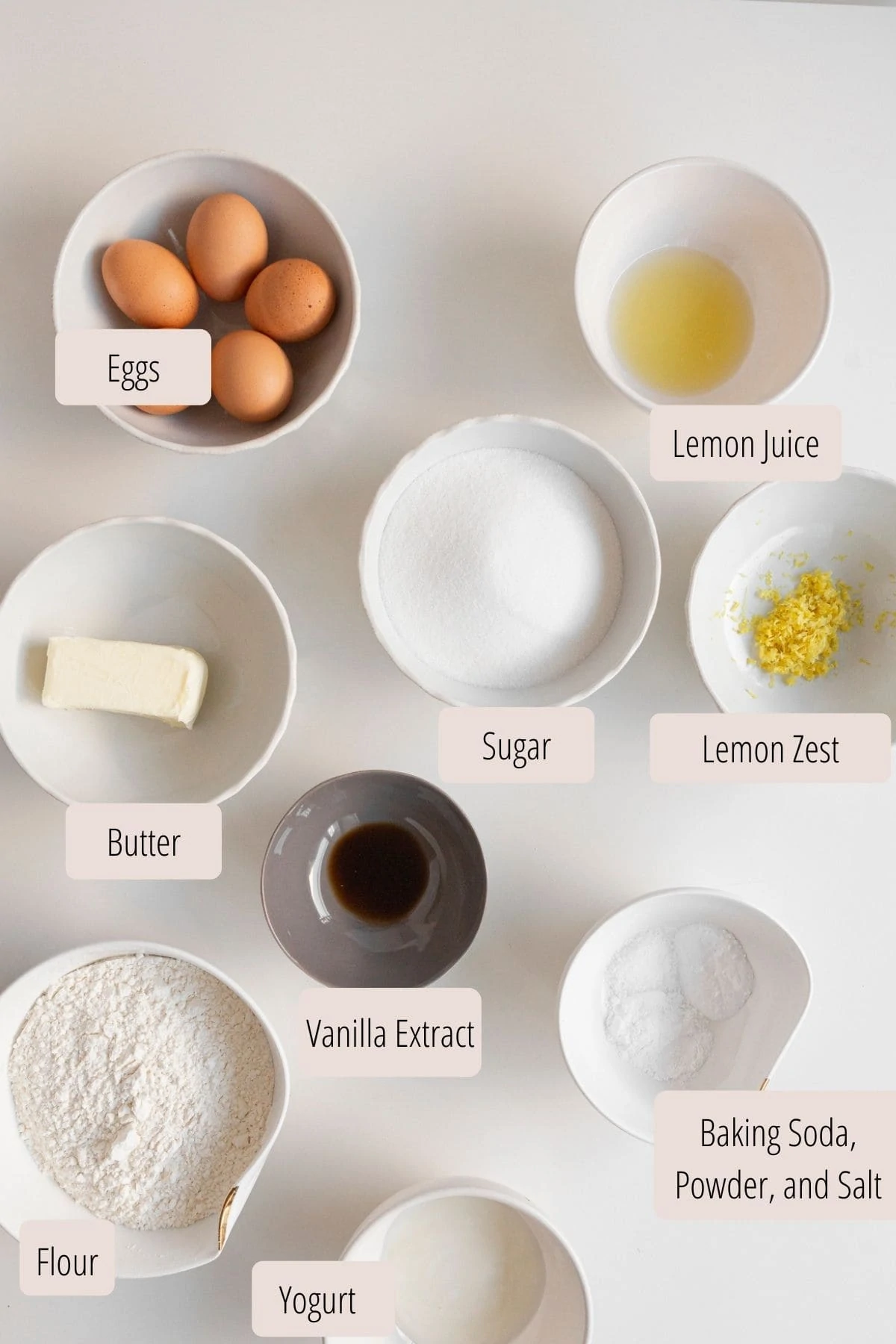 Lemon cake ingredients laid out in bowls