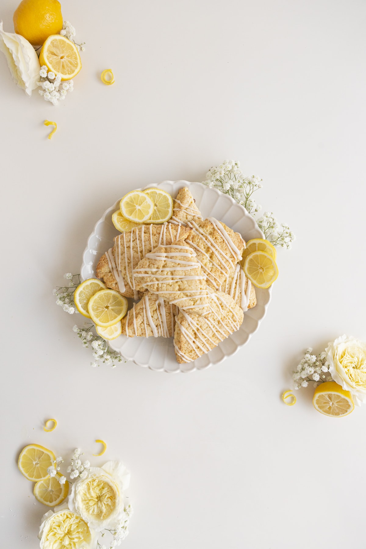 lemon scones with slices of lemon and flowers
