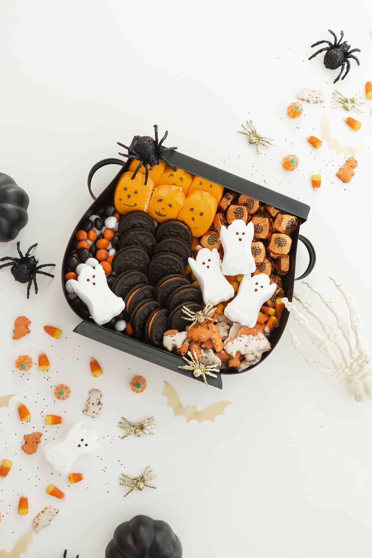 halloween candy charcuterie board with peeps, oreos, and candy