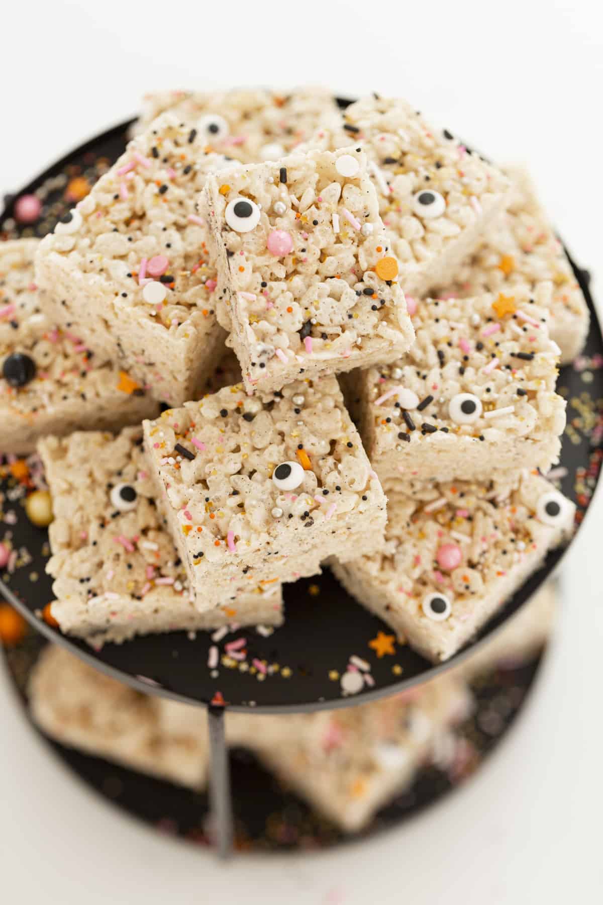 rice krispie treats with sprinkles and googly eyes on tray