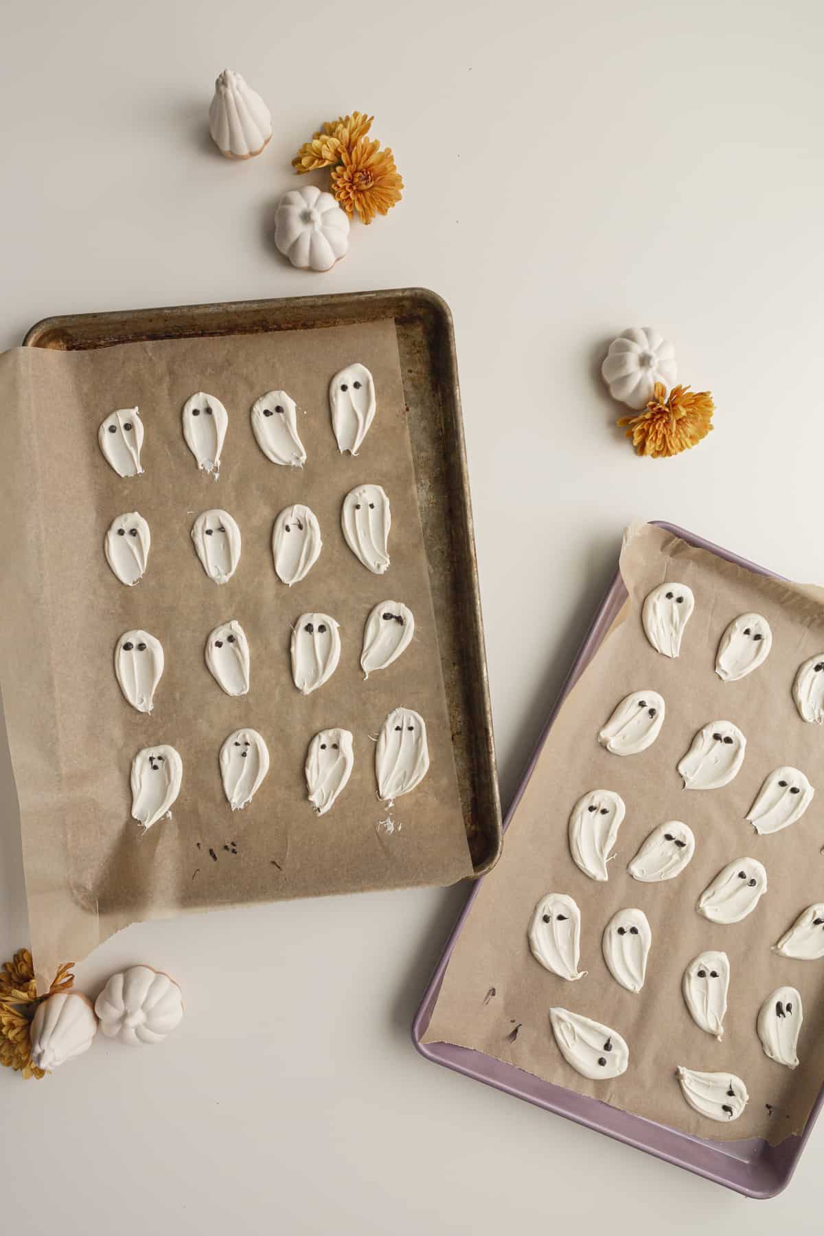 candy melts in swoops on parchment paper with eyes