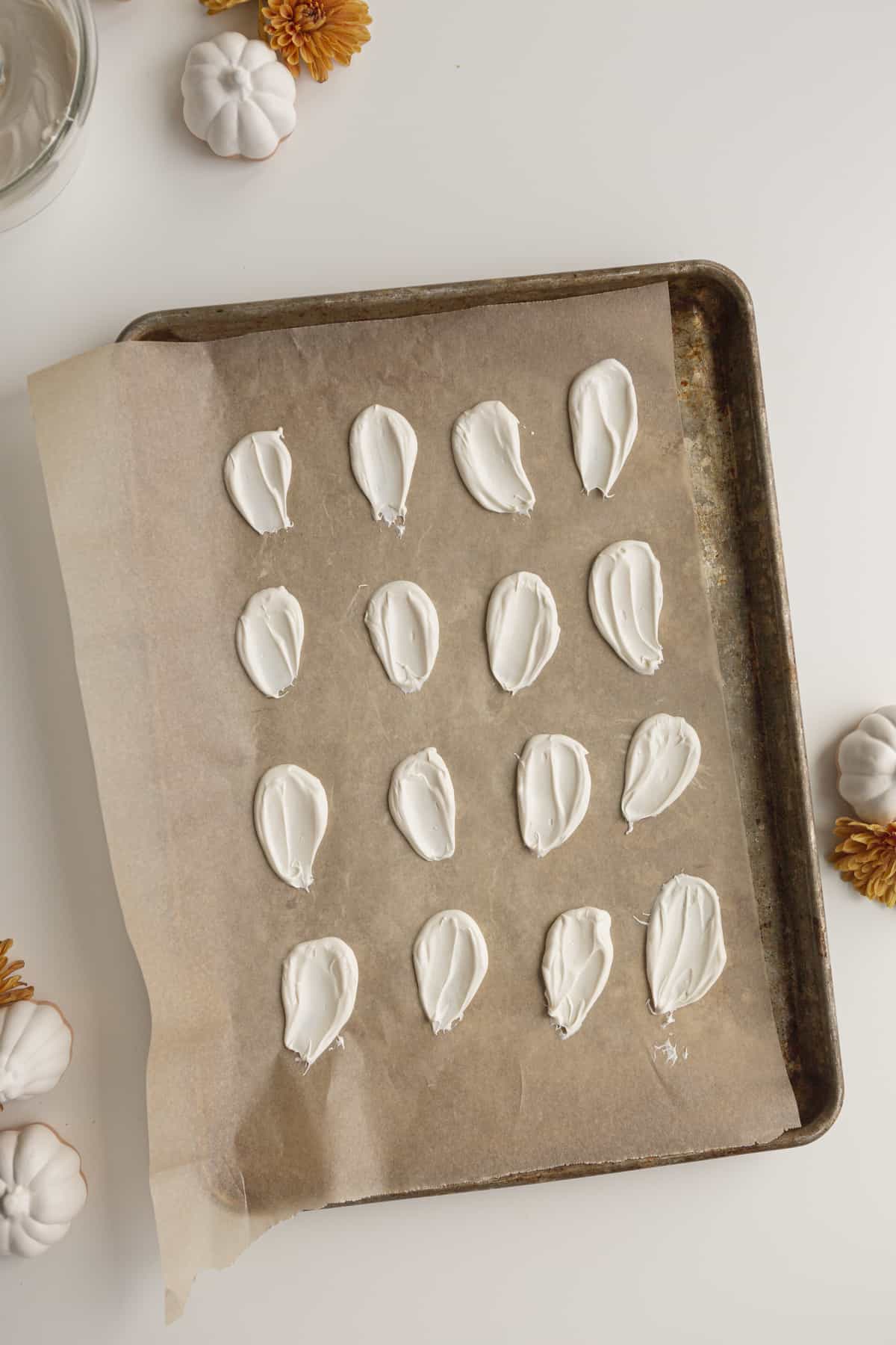 candy melts in swoops on parchment paper