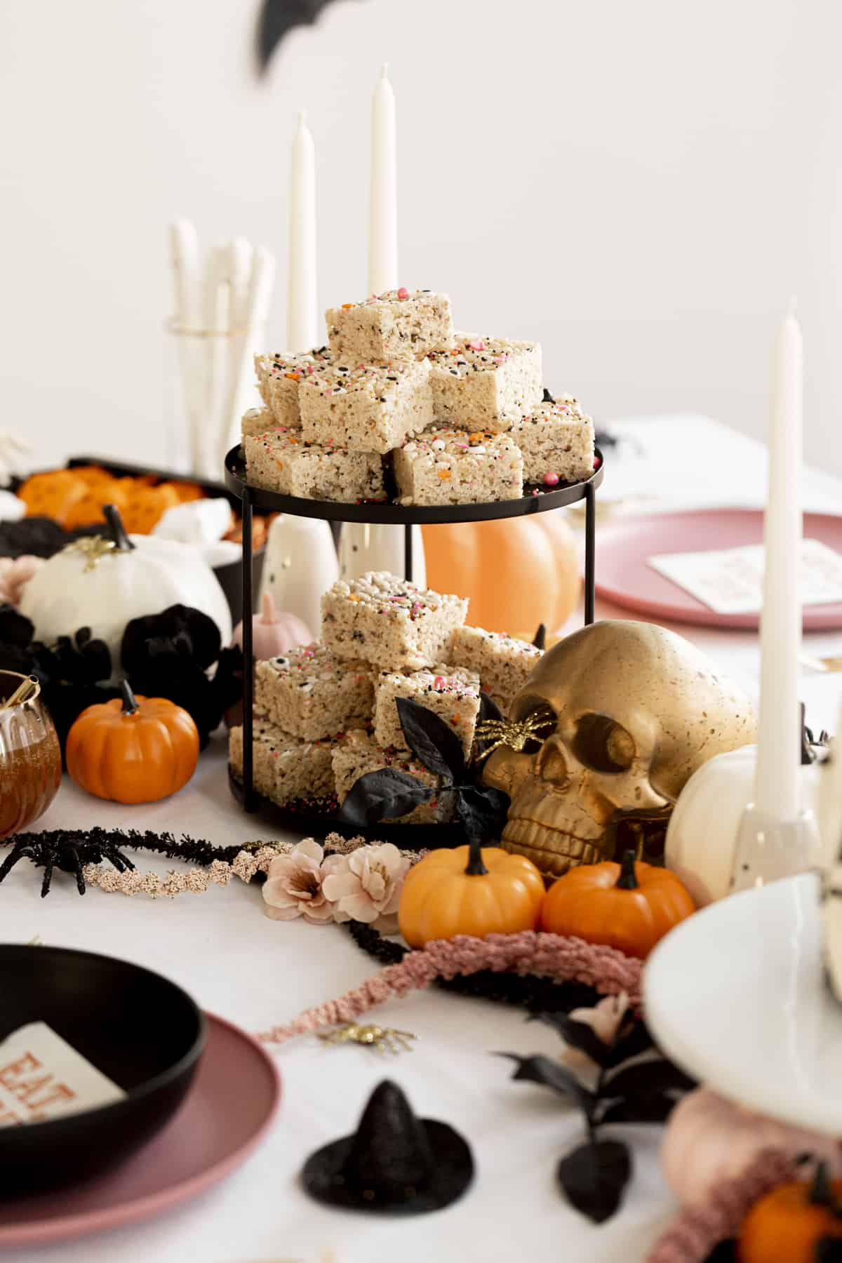 brown butter rice krispie treats on two tier tray on table